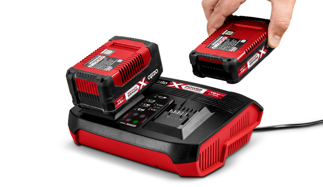 The Ozito Power X-Change (PXC) system is a battery-powered tool platform where a single 18V rechargeable battery can be used to power a wide range of cordless tools, from garden equipment to workshop tools. It offers cost savings, flexibility, and environmental benefits by eliminating the need for multiple chargers and batteries. The system also includes a "Twin-Pack" technology, which allows two 18V batteries to be combined for tools requiring more power, such as a 36V output.